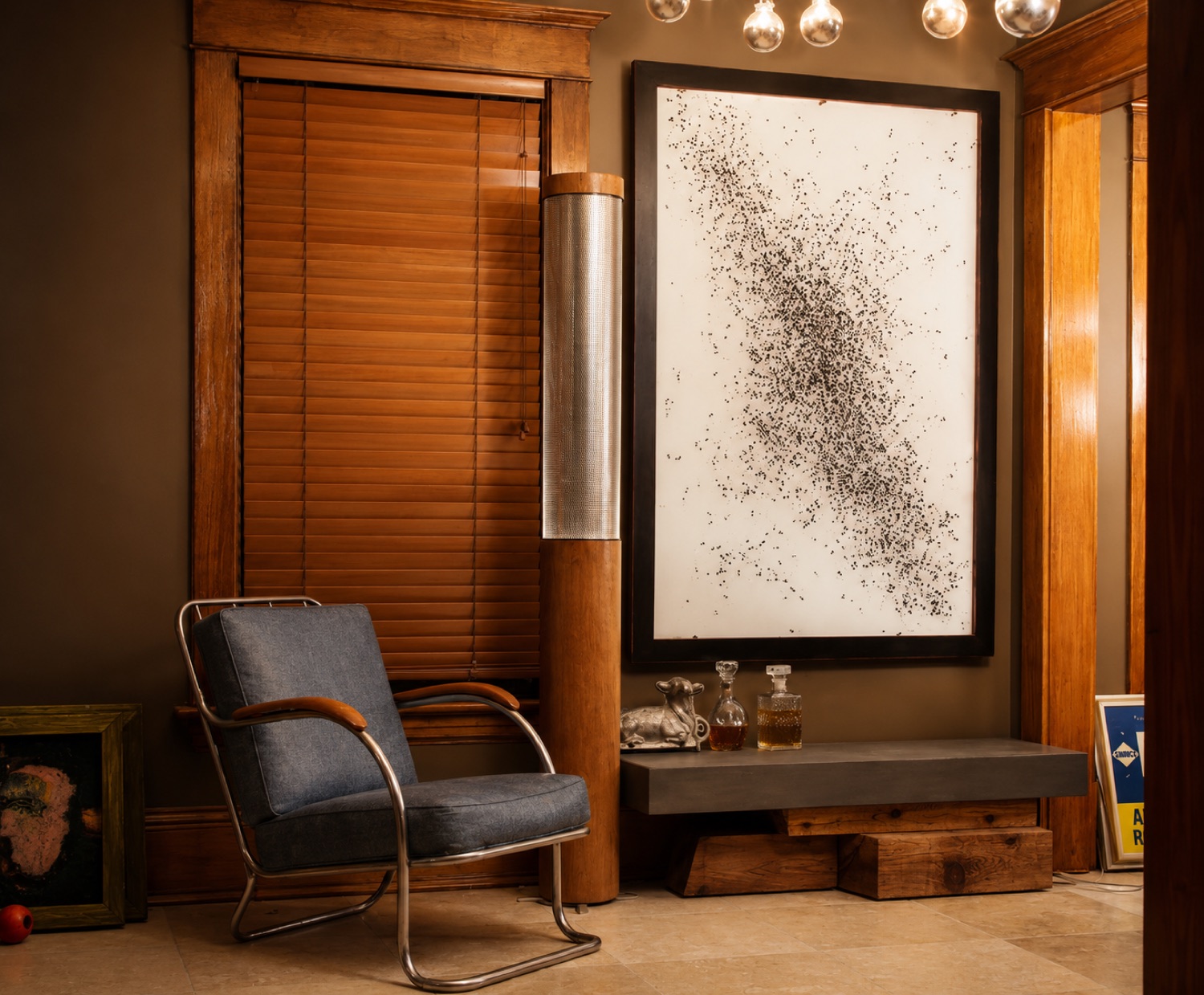 Large framed scatter-field artwork in a styled interior